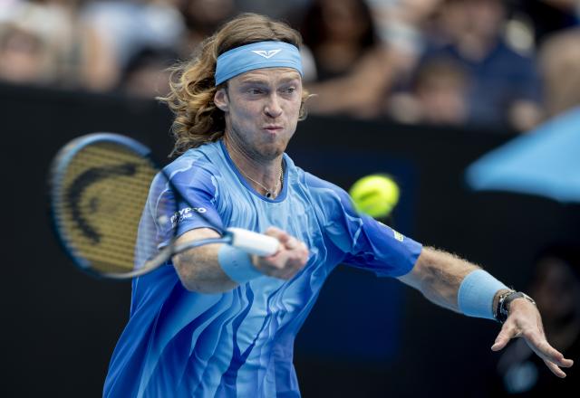 (260119) -- MELBOURNE, Jan. 19, 2026 (Xinhua) -- Andrey Rublev of Russia hits a return during the men's singles 1st round match against Matteo Arnaldi of Italy at the Australian Open tennis tournament in Melbourne, Australia, Jan. 19, 2026. (Photo by Hu Jingchen/Xinhua)