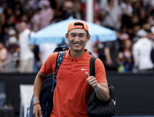 (260119) -- MELBOURNE, Jan. 19, 2026 (Xinhua) -- Shang Juncheng of China celebrates after winning the men's singles 1st round match against Roberto Bautista Agut of Spain at the Australian Open tennis tournament in Melbourne, Australia, Jan. 19, 2026. (Xinhua/Ma Ping)