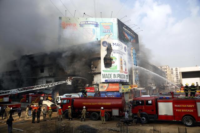 (260119) -- KARACHI, Jan. 19, 2026 (Xinhua) -- Firefighters try to extinguish a fire breaking out at a shopping mall in Karachi, Pakistan, on Jan. 18, 2026. The death toll from a fire at a shopping mall in Pakistan's southern port city of Karachi rose to 14 on Monday morning after rescue teams recovered more bodies during a search operation, officials said. (Xinhua)