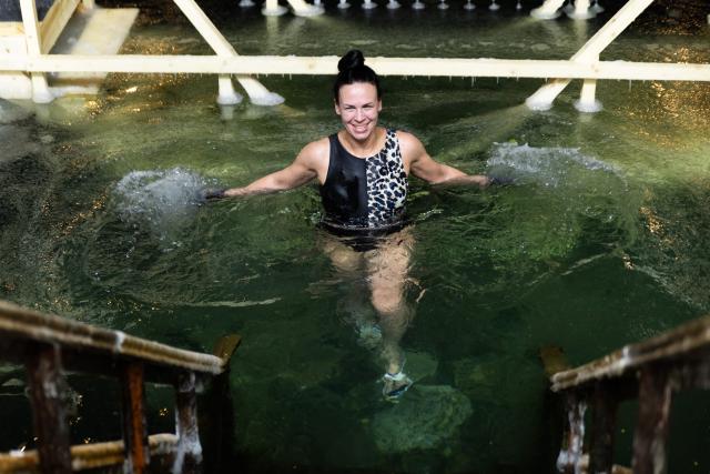 (260119) -- VLADIVOSTOK, Jan. 19, 2026 (Xinhua) -- A woman bathes in the icy water during the Orthodox Epiphany celebrations in Vladivostok, Russia, Jan. 18, 2026. (Photo by Andrey Matveenko/Xinhua)