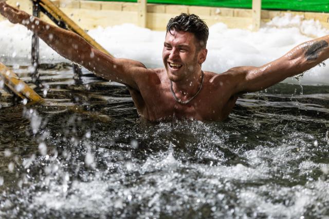 (260119) -- VLADIVOSTOK, Jan. 19, 2026 (Xinhua) -- A man bathes in the icy water during the Orthodox Epiphany celebrations in Vladivostok, Russia, Jan. 18, 2026. (Photo by Andrey Matveenko/Xinhua)