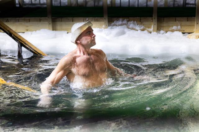 (260119) -- VLADIVOSTOK, Jan. 19, 2026 (Xinhua) -- A man bathes in the icy water during the Orthodox Epiphany celebrations in Vladivostok, Russia, Jan. 18, 2026. (Photo by Andrey Matveenko/Xinhua)