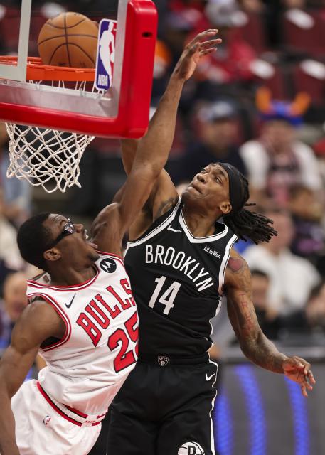 (260119) -- CHICAGO, Jan. 19, 2026 (Xinhua) -- Brooklyn Nets' Terance Mann (R) dunks during the 2025-2026 NBA regular season basketball game between Brooklyn Nets and Chicago Bulls at United Center in Chicago, the United States, Jan. 18, 2026. (Photo by Joel Lerner/Xinhua)