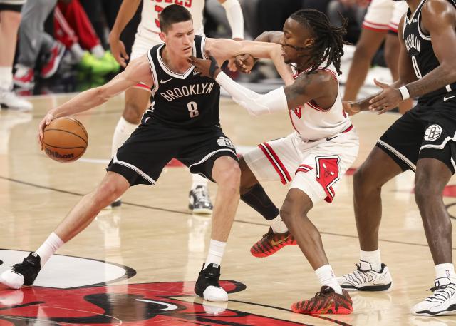 (260119) -- CHICAGO, Jan. 19, 2026 (Xinhua) -- Brooklyn Nets' Egor Demin (L) vies with Chicago Bulls' Ayo Dosunmu during the 2025-2026 NBA regular season basketball game between Brooklyn Nets and Chicago Bulls at United Center in Chicago, the United States, Jan. 18, 2026. (Photo by Joel Lerner/Xinhua)