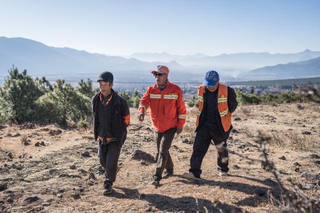 (260119) -- LIJIANG, Jan. 19, 2026 (Xinhua) -- Forest rangers of Yuhu Village conduct patrols at the foot of Yulong Snow Mountain in Lijiang, southwest China's Yunnan Province, Jan. 18, 2026. Yuhu Village, nestled in Baisha Township of Yulong Naxi Autonomous County in the city of Lijiang in Yunnan, is one of the earliest settlements of the Naxi ethnic people. The village was once among the poorest villages in Lijiang because of its poor soil and limited transportation links.   
  In recent years, Yuhu has developed a distinct path that balances economic growth with environmental protection. Leveraging its well-preserved Naxi cultural heritage and exceptional natural scenery, the village has attracted visitors from around the world. At the same time, it has continued to improve infrastructure and public services, attracting a growing number of residents to return home for businesses.  
  In 2025, Yuhu Village welcomed about 1.2 million visits, generating 75 million yuan (10.8 million U.S. dollars) in revenue -- with the average income of locals increasing from 13,000 yuan (1,865 U.S. dollars) in 2019 to about 35,000 yuan (5,022 U.S. dollars). (Xinhua/Wang Guansen)