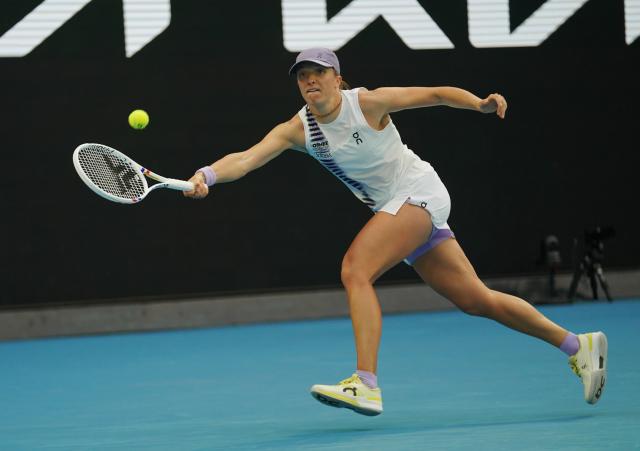 (260119) -- MELBOURNE, Jan. 19, 2026 (Xinhua) -- Iga Swiatek hits a return during the women's singles 1st round match between Yuan Yue of China and Iga Swiatek of Poland at the Australian Open tennis tournament in Melbourne, Australia, Jan. 19, 2026. (Photo by Wang Shen/Xinhua)
