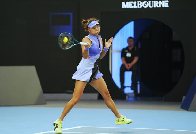 (260119) -- MELBOURNE, Jan. 19, 2026 (Xinhua) -- Yuan Yue hits a return during the women's singles 1st round match between Yuan Yue of China and Iga Swiatek of Poland at the Australian Open tennis tournament in Melbourne, Australia, Jan. 19, 2026. (Photo by Wang Shen/Xinhua)