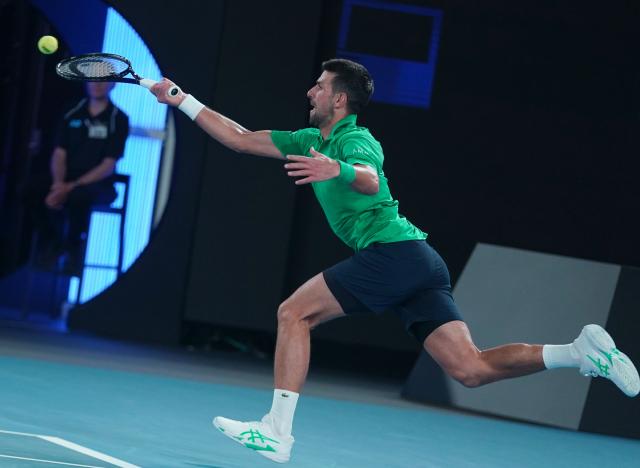 (260119) -- MELBOURNE, Jan. 19, 2026 (Xinhua) -- Novak Djokovic hits a return during the men's singles 1st round match between Pedro Martinez of Spain and Novak Djokovic of Serbia at the Australian Open tennis tournament in Melbourne, Australia, Jan. 19, 2026. (Photo by Wang Shen/Xinhua)