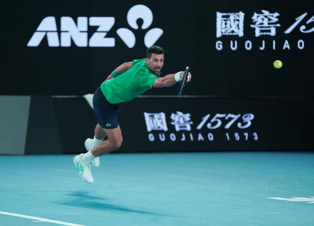 (260119) -- MELBOURNE, Jan. 19, 2026 (Xinhua) -- Novak Djokovic hits a return during the men's singles 1st round match between Pedro Martinez of Spain and Novak Djokovic of Serbia at the Australian Open tennis tournament in Melbourne, Australia, Jan. 19, 2026. (Photo by Wang Shen/Xinhua)