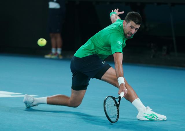 (260119) -- MELBOURNE, Jan. 19, 2026 (Xinhua) -- Novak Djokovic hits a return during the men's singles 1st round match between Pedro Martinez of Spain and Novak Djokovic of Serbia at the Australian Open tennis tournament in Melbourne, Australia, Jan. 19, 2026. (Photo by Wang Shen/Xinhua)