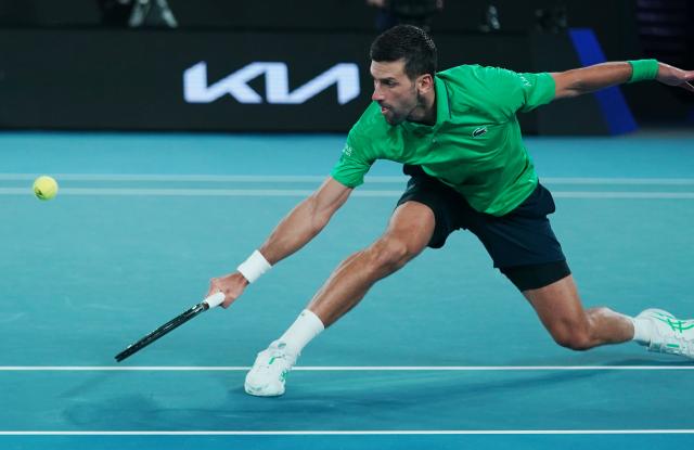 (260119) -- MELBOURNE, Jan. 19, 2026 (Xinhua) -- Novak Djokovic hits a return during the men's singles 1st round match between Pedro Martinez of Spain and Novak Djokovic of Serbia at the Australian Open tennis tournament in Melbourne, Australia, Jan. 19, 2026. (Photo by Wang Shen/Xinhua)