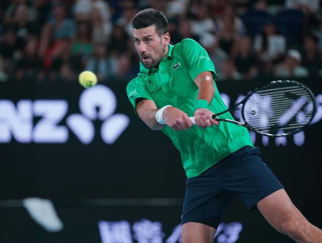 (260119) -- MELBOURNE, Jan. 19, 2026 (Xinhua) -- Novak Djokovic hits a return during the men's singles 1st round match between Pedro Martinez of Spain and Novak Djokovic of Serbia at the Australian Open tennis tournament in Melbourne, Australia, Jan. 19, 2026. (Photo by Wang Shen/Xinhua)