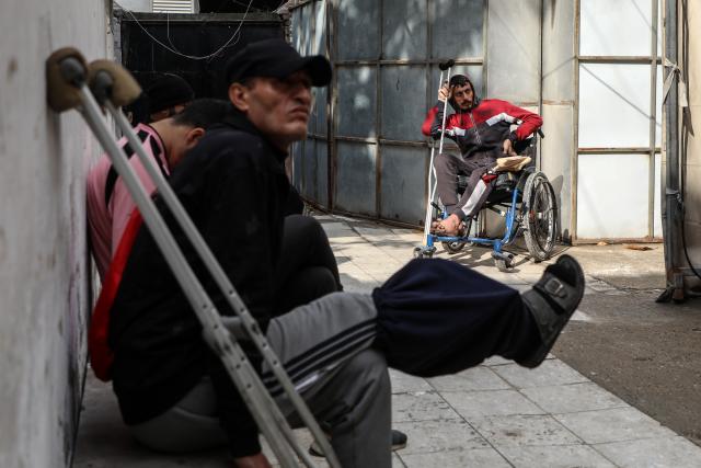 (260119) -- GAZA, Jan. 19, 2026 (Xinhua) -- Injured Palestinians wait in a health center in Gaza City, Jan. 19, 2026. (Photo by Rizek Abdeljawad/Xinhua)