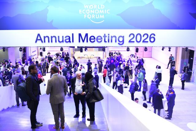 (260120) -- DAVOS, Jan. 20, 2026 (Xinhua) -- People attend the welcome reception at the 2026 annual meeting of the World Economic Forum (WEF) in Davos, Switzerland, Jan. 19, 2026. The 2026 annual meeting of the WEF opened on Monday evening in the Swiss Alpine town of Davos, calling for constructive dialogue in a complex global landscape. (Xinhua/Lian Yi)