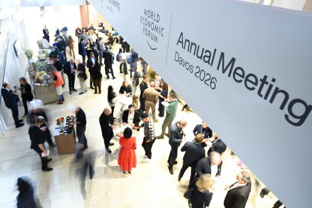 (260120) -- DAVOS, Jan. 20, 2026 (Xinhua) -- People attend the welcome reception at the 2026 annual meeting of the World Economic Forum (WEF) in Davos, Switzerland, Jan. 19, 2026. The 2026 annual meeting of the WEF opened on Monday evening in the Swiss Alpine town of Davos, calling for constructive dialogue in a complex global landscape. (Xinhua/Lian Yi)