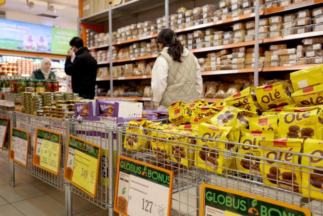 (260120) -- BISHKEK, Jan. 20, 2026 (Xinhua) -- People select goods in a supermarket in Bishkek, Kyrgyzstan, Jan. 15, 2026. Kyrgyzstan's gross domestic product (GDP) surged 11.1 percent last year to reach 22.6 billion U.S. dollars, according to official data released on Monday. (Photo by Roman/Xinhua)