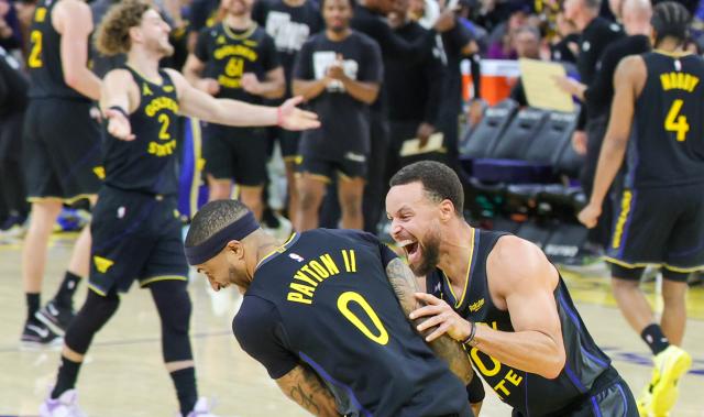 (260120) -- SAN FRANCISCO, Jan. 20, 2026 (Xinhua) -- Golden State Warriors' Stephen Curry (front R) celebrates with his teammate Gary Payton II after Payton scored during the 2025-2026 NBA regular season basketball game between Golden State Warriors and Miami Heat in San Francisco, the United States, Jan. 19, 2026. (Photo by Arthur Dong/Xinhua)