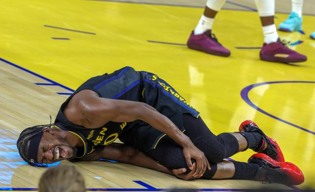 (260120) -- SAN FRANCISCO, Jan. 20, 2026 (Xinhua) -- Golden State Warriors' Jimmy Butler III holds his right knee after being injured during the 2025-2026 NBA regular season basketball game between Golden State Warriors and Miami Heat in San Francisco, the United States, Jan. 19, 2026. (Photo by Arthur Dong/Xinhua)