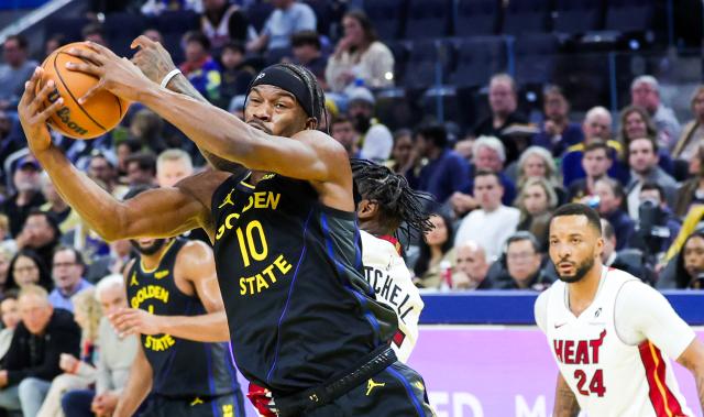 (260120) -- SAN FRANCISCO, Jan. 20, 2026 (Xinhua) -- Golden State Warriors' Jimmy Butler III (front) vies for the ball during the 2025-2026 NBA regular season basketball game between Golden State Warriors and Miami Heat in San Francisco, the United States, Jan. 19, 2026. (Photo by Arthur Dong/Xinhua)