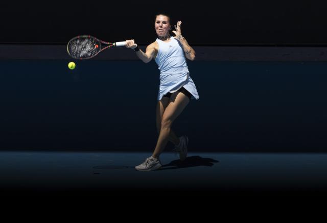 (260120) -- MELBOURNE, Jan. 20, 2026 (Xinhua) -- Oleksandra Oliynykova of Ukraine hits a return during the women's singles 1st round match against Madison Keys of the United States at the Australian Open tennis tournament in Melbourne, Australia, Jan. 20, 2026. (Photo by Hu Jingchen/Xinhua)