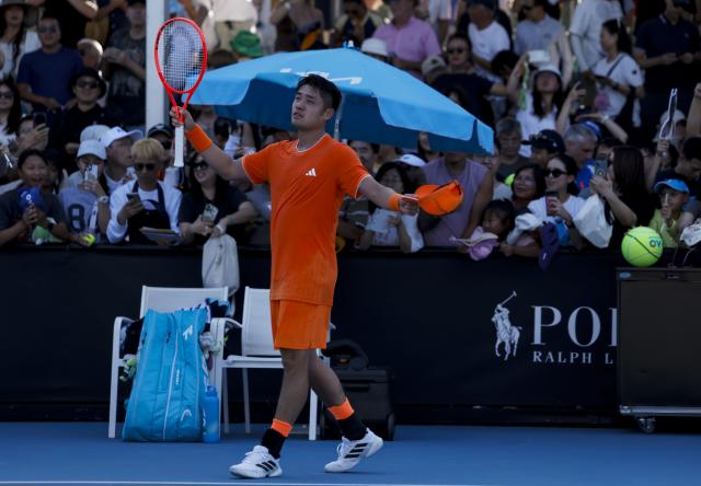 (260120) -- MELBOURNE, Jan. 20, 2026 (Xinhua) -- Wu Yibing of China reacts after winning the men's singles 1st round match against Luca Nardi of Italy at the Australian Open tennis tournament in Melbourne, Australia, Jan. 20, 2026. (Xinhua/Ma Ping)