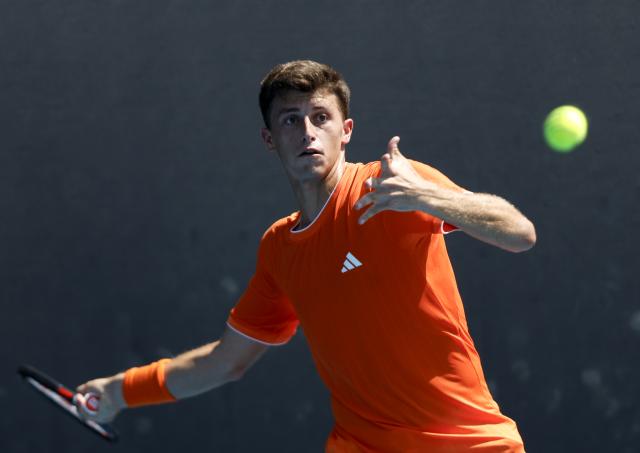 (260120) -- MELBOURNE, Jan. 20, 2026 (Xinhua) -- Luca Nardi of Italy hits a return during the men's singles 1st round match against Wu Yibing of China at the Australian Open tennis tournament in Melbourne, Australia, Jan. 20, 2026. (Xinhua/Ma Ping)