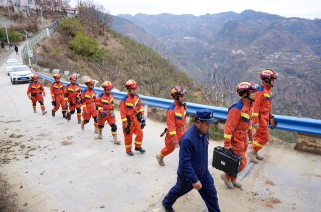 (260120) -- ZHAOTONG, Jan. 20, 2026 (Xinhua) -- Rescue workers are seen patrolling in Hongshiyan Village after an earthquake in Qiaojia County, southwest China's Yunnan Province, Jan. 20, 2026. A 5.1-magnitude earthquake jolted Qiaojia County in southwest China's Yunnan Province on Monday evening, prompting local authorities to evacuate dozens of residents, though no casualties or building collapses were reported. The China Earthquake Administration has activated a Level-III emergency response to the earthquake in Yunnan and dispatched working teams to the affected area to support local relief efforts. (Xinhua/Chen Xinbo)