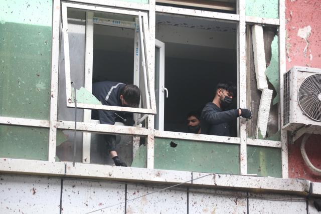 (260120) -- KABUL, Jan. 20, 2026 (Xinhua) -- Staff members clean broken window glasses at the site of an explosiont in Kabul, Afghanistan, Jan. 20, 2026. At least 20 people, including women and children, were transported to EMERGENCY's Surgical Center in Kabul following an explosion in the downtown area on Monday afternoon, with seven declared dead on arrival, the humanitarian organization said. According to media reports, the Islamic State has claimed responsibility for the incident.
  Chinese foreign ministry spokesperson Guo Jiakun said at a regular news briefing that one Chinese citizen was killed and five were injured in the explosion, adding that the Chinese side has made emergency representations to the Afghan side, urging it to make every effort to treat the injured. (Photo by Saifurahman Safi/Xinhua)