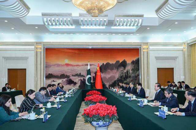 (260120) -- BEIJING, Jan. 20, 2026 (Xinhua) -- Wang Huning, chairman of the National Committee of the Chinese People's Political Consultative Conference (CPPCC), meets with Sardar Ayaz Sadiq, speaker of the National Assembly of Pakistan, in Beijing, capital of China, Jan. 20, 2026. (Xinhua/Rao Aimin)