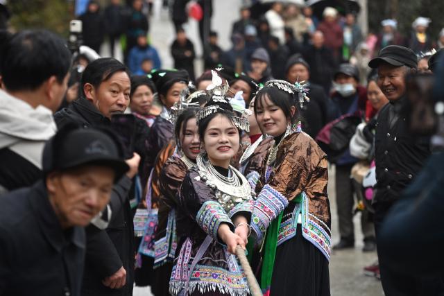 (260120) -- LIUZHOU, Jan. 20, 2026 (Xinhua) -- Girls of Miao ethnic group attend a tug-of-war game during traditional Miao New Year celebrations at Dangjiu Village in Gandong Township of Rongshui Miao Autonomous County, south China's Guangxi Zhuang Autonomous Region, Jan. 20, 2026, also the Great Cold (Dahan) solar term on the Chinese lunar calendar. Miao New Year is a major festival of people of Miao ethnic group. In 2008, the festival was listed as a national-level intangible cultural heritage. (Xinhua/Huang Xiaobang)