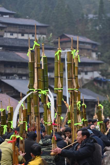 (260120) -- LIUZHOU, Jan. 20, 2026 (Xinhua) -- Villagers of Miao ethnic group play Lusheng, a traditional reed-pipe wind instrument, during traditional Miao New Year celebrations at Dangjiu Village in Gandong Township of Rongshui Miao Autonomous County, south China's Guangxi Zhuang Autonomous Region, Jan. 20, 2026, also the Great Cold (Dahan) solar term on the Chinese lunar calendar. Miao New Year is a major festival of people of Miao ethnic group. In 2008, the festival was listed as a national-level intangible cultural heritage. (Xinhua/Huang Xiaobang)