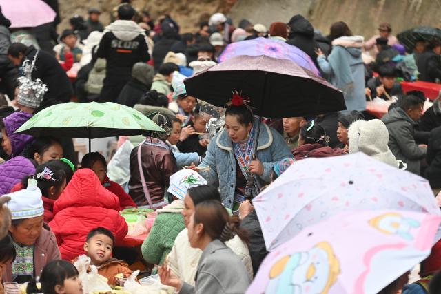 (260120) -- LIUZHOU, Jan. 20, 2026 (Xinhua) -- Villagers of Miao ethnic group and tourists attend a banquet during traditional Miao New Year celebrations at Dangjiu Village in Gandong Township of Rongshui Miao Autonomous County, south China's Guangxi Zhuang Autonomous Region, Jan. 20, 2026, also the Great Cold (Dahan) solar term on the Chinese lunar calendar. Miao New Year is a major festival of people of Miao ethnic group. In 2008, the festival was listed as a national-level intangible cultural heritage. (Xinhua/Huang Xiaobang)