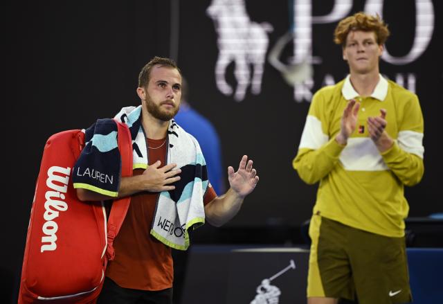 (260120) -- MELBOURNE, Jan. 20, 2026 (Xinhua) -- Hugo Gaston (L) leaves the court during the men's singles 1st round match between Hugo Gaston of France and Jannik Sinner of Italy at the Australian Open tennis tournament in Melbourne, Australia, Jan. 20, 2026. (Photo by Wang Shen/Xinhua)