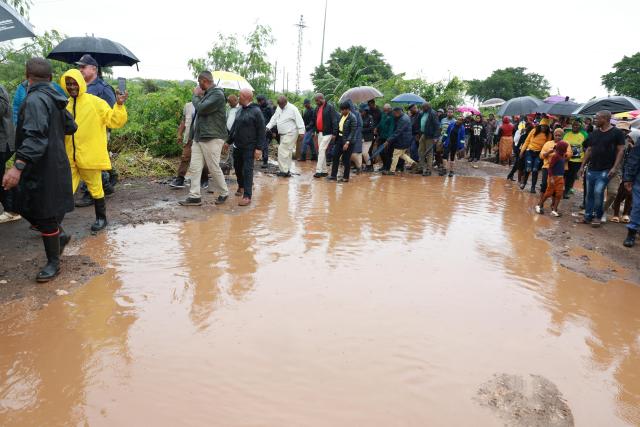 (260120) -- JOHANNESBURG, Jan. 20, 2026 (Xinhua) -- South African President Cyril Ramaphosa inspects flood-hit areas in Nkomazi, Mpumalanga Province, South Africa, on Jan. 19, 2026. Weeks of persistent heavy rainfall and widespread flooding have struck several countries in Southern Africa, including South Africa, Mozambique and Zimbabwe, leaving more than 200 people dead, destroying property and prompting large-scale evacuations and rescue operations.
   South Africa's National Disaster Management Centre declared a national disaster on Sunday as heavy rains and flooding continued to batter northern parts of the country. (GCIS/Handout via Xinhua)