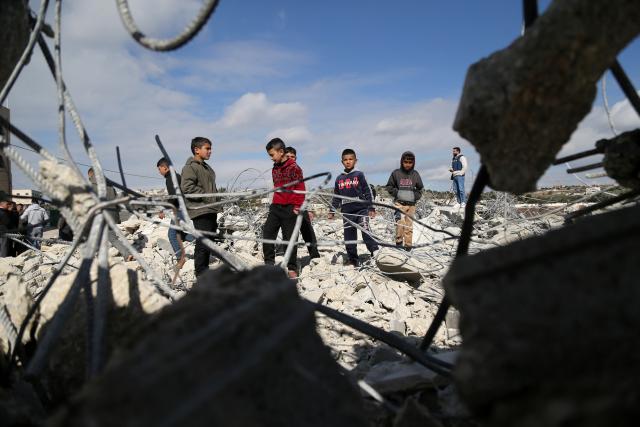 (260120) -- HEBRON, Jan. 20, 2026 (Xinhua) -- Palestinian boys are seen in a destroyed house after the Israeli forces demolished it, in the West Bank city of Hebron, Jan. 20, 2026. (Photo by Mamoun Wazwaz/Xinhua)