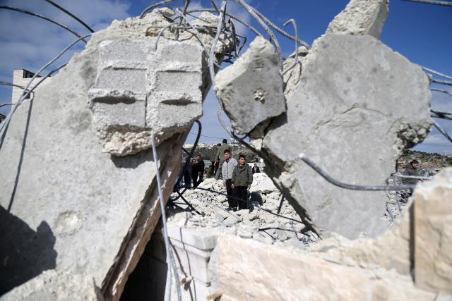 (260120) -- HEBRON, Jan. 20, 2026 (Xinhua) -- Palestinians inspect a destroyed house after the Israeli forces demolished it, in the West Bank city of Hebron, Jan. 20, 2026. (Photo by Mamoun Wazwaz/Xinhua)