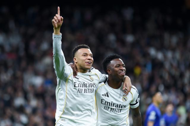 (260121) -- MADRID, Jan. 21, 2026(Xinhua) -- Real Madrid's Kylian Mbappe (L) celebrates a goal with teammate Vinicius Junior during the UEFA Champions League match between Real Madrid and AS Monaco, Madrid, Spain, Jan. 20, 2026. (Photo by Gustavo Valiente/Xinhua)