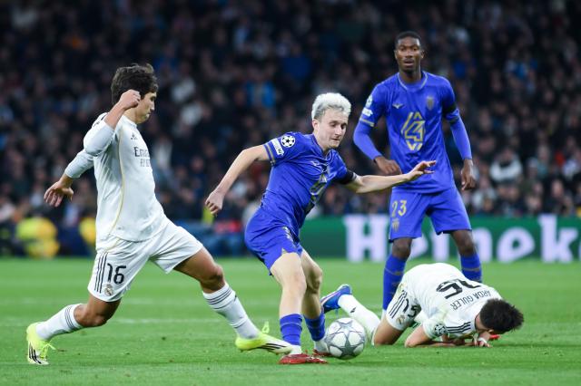 (260121) -- MADRID, Jan. 21, 2026(Xinhua) -- Real Madrid's Gonzalo Garcia (1st L) vies with AS Monaco's Golovin (2nd L) during the UEFA Champions League match between Real Madrid and AS Monaco, Madrid, Spain, Jan. 20, 2026. (Photo by Gustavo Valiente/Xinhua)