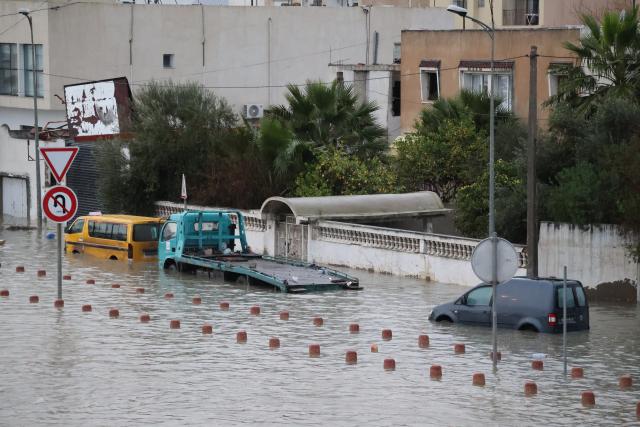 (260121) -- TUNIS, Jan. 21, 2026 (Xinhua) -- Vehicles are stranded on a flooded road in Tunis, Tunisia, Jan. 20, 2026. At least four people have been killed in Tunisia as the heaviest rainfall since 1950 caused flooding in the country, the state-run Tunis Afrique Presse (TAP) reported Tuesday. (Xinhua/Zhou Haojin)