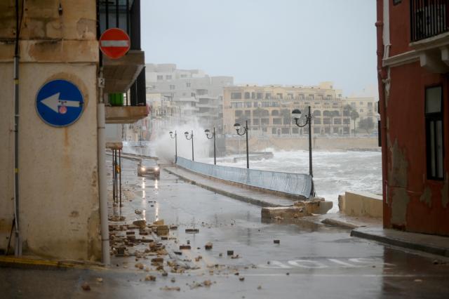 (260121) --  MARSASCALA, Jan. 21, 2026 (Xinhua) -- A car drives along the seashore after Storm Harry hit Marsascala, eastern Malta, on Jan. 20, 2026. The coast of Malta was hit by strong winds and high waves as Storm Harry battered its islands. (Photo by Jonathan Borg/Xinhua)