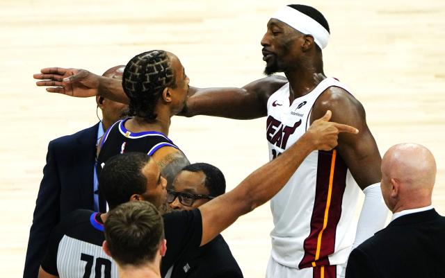 (260121) -- SACRAMENTO, Jan. 21, 2026 (Xinhua) -- Sacramento Kings' DeMar DeRozan (top L) talks with Miami Heats' Bam Adebayo (top R) during the 2025-2026 NBA regular season basketball game between Miami Heats and Sacramento Kings in Sacramento, the United States, Jan. 20, 2026. (Xinhua/Wu Xiaoling)