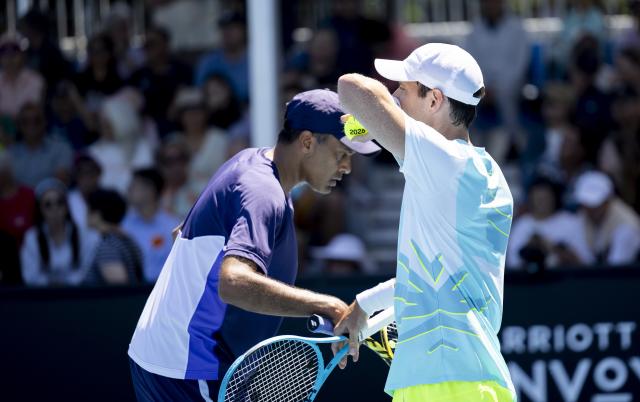 (260121) -- MELBOURNE, Jan. 21, 2026 (Xinhua) -- Rajeev Ram (L) of the United States/Matthew Ebden of Australia react during the men's doubles 1st round match against Zhang Zhizhen/Shang Juncheng of China at the Australian Open tennis tournament in Melbourne, Australia, Jan. 21, 2026. (Photo by Hu Jingchen/Xinhua)