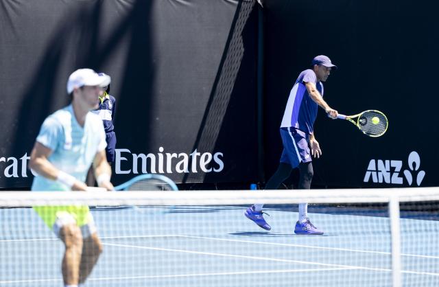 (260121) -- MELBOURNE, Jan. 21, 2026 (Xinhua) -- Rajeev Ram (R) of the United States/Matthew Ebden of Australia compete during the men's doubles 1st round match against Zhang Zhizhen/Shang Juncheng of China at the Australian Open tennis tournament in Melbourne, Australia, Jan. 21, 2026. (Photo by Hu Jingchen/Xinhua)