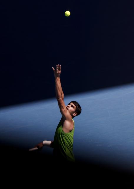 (260121) -- MELBOURNE, Jan. 21, 2026 (Xinhua) -- Carlos Alcaraz of Spain serves during the men's singles 2nd round match against Yannick Hanfmann of Germany at the Australian Open tennis tournament in Melbourne, Australia, Jan. 21, 2026. (Xinhua/Ma Ping)