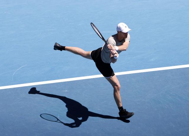 (260121) -- MELBOURNE, Jan. 21, 2026 (Xinhua) -- Yannick Hanfmann of Germany hits a return during the men's singles 2nd round match against Carlos Alcaraz of Spain at the Australian Open tennis tournament in Melbourne, Australia, Jan. 21, 2026. (Xinhua/Ma Ping)