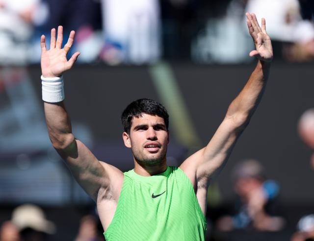 (260121) -- MELBOURNE, Jan. 21, 2026 (Xinhua) -- Carlos Alcaraz of Spain celebrates after winning the men's singles 2nd round match against Yannick Hanfmann of Germany at the Australian Open tennis tournament in Melbourne, Australia, Jan. 21, 2026. (Xinhua/Ma Ping)