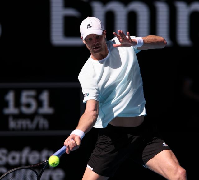 (260121) -- MELBOURNE, Jan. 21, 2026 (Xinhua) -- Yannick Hanfmann of Germany hits a return during the men's singles 2nd round match against Carlos Alcaraz of Spain at the Australian Open tennis tournament in Melbourne, Australia, Jan. 21, 2026. (Xinhua/Ma Ping)