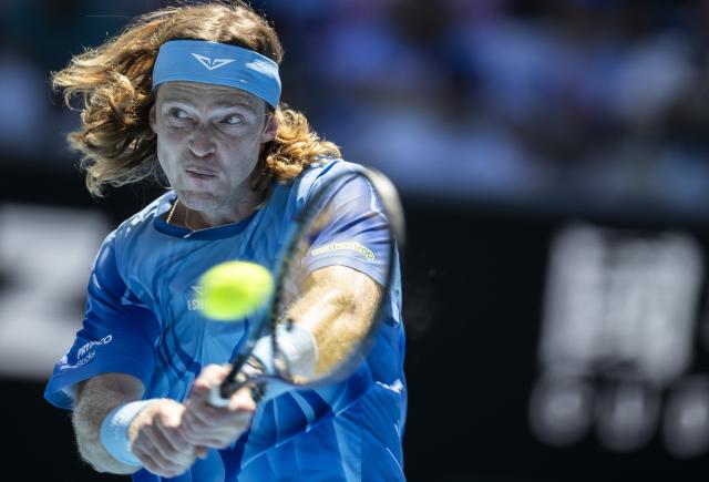 (260121) -- MELBOURNE, Jan. 21, 2026 (Xinhua) -- Andrey Rublev of Russia hits a return during the men's singles 2nd round match against Jaime Faria of Portugal at the Australian Open tennis tournament in Melbourne, Australia, Jan. 21, 2026 (Photo by Hu Jingchen/Xinhua)