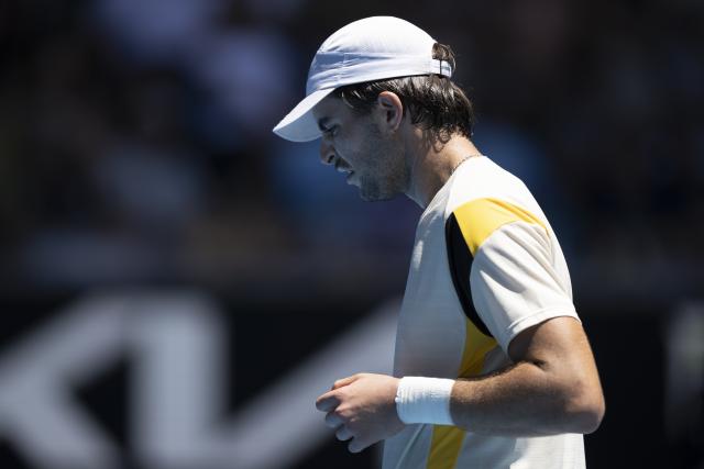 (260121) -- MELBOURNE, Jan. 21, 2026 (Xinhua) -- Jaime Faria of Portugal reacts during the men's singles 2nd round match against Andrey Rublev of Russia at the Australian Open tennis tournament in Melbourne, Australia, Jan. 21, 2026 (Photo by Hu Jingchen/Xinhua)