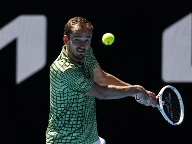 (260121) -- MELBOURNE, Jan. 21, 2026 (Xinhua) -- Daniil Medvedev of Russia hits a return during the men's singles 2nd round match between Daniil Medvedev of Russia and Quentin Halys of France at the Australian Open tennis tournament in Melbourne, Australia, Jan. 21, 2026. (Xinhua/Ma Ping)